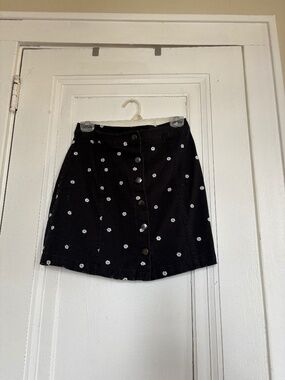 Women’s mini button daisy skirt